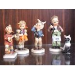 A COLLECTION GOEBEL FIGURES TO INCLUDE A SEATED CAT FIGURE (5)