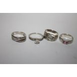 FOUR STERLING SILVER LADIES DRESS RINGS