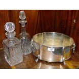 A SILVER PLATED TWIN HANDLED ICE BUCKET TOGETHER WITH TWO CUT GLASS DECANTERS