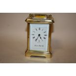 A VINTAGE BRASS CARRIAGE CLOCK BY LONDON CLOCK CO., WITH KEY, A/F
