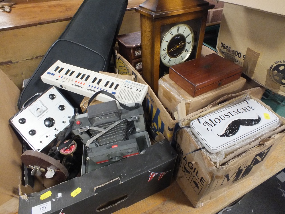 TWO TRAYS OF COLLECTABLES TO INCLUDE CERAMIC MOUSTACHE SIGNS, SEIKO WALL CLOCK ETC.