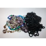 A BAG OF AMETHYST AND OTHER BEADED NECKLACES