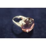 A MODERN SILVER / 925 DRESS RING SET WITH LARGE PINK CABOCHON TYPE STONE - APPROX 16.1 G