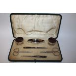 A HALLMARKED SILVER AND TORTOISE SHELL MANICURE SET