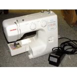 A MODERN JANOME JR1012 ELECTRIC SEWING MACHINE