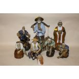 A COLLECTION OF EIGHT ORIENTAL CERAMIC FIGURES