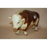 A LARGE CERAMIC BUTCHERS SHOP STYLE FIGURE OF A HEREFORD BULL, LENGTH 36 CM
