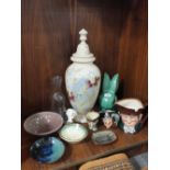 A LARGE HAND PAINTED GLASS LIDDED VASE TOGETHER WITH THREE ROYAL DOULTON CHARACTER JUGS, SYLVAC