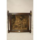 AN ANTIQUE TAPESTRY/ NEEDLEWORK PANEL DEPICTING AN INTERIOR SCENE WITH FIGURES IN OAK BARLEY TWIST