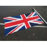 A 16FT ALUMINIUM FLAG POLE WITH A STITCHED, COTTON UNION JACK FLAG