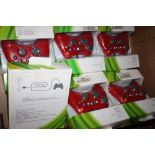 A TRAY OF BOXED GAMING CONTROLLERS