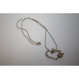 A SILVER HEART PENDANT ON CHAIN