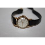 A LADIES 9 CT GOLD ETERNAMATIC WRISTWATCH ON LEATHER STRAP