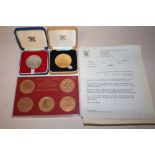 A ROYAL MINT COMMEMORATIVE QUEENS SILVER JUBILEE MEDAL TOGETHER WITH A BRONZE EXAMPLE AND A