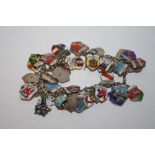 A SILVER AND ENAMEL CHARM BRACELET