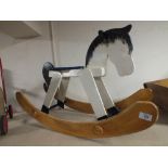 A MODERN WOODEN ROCKING HORSE