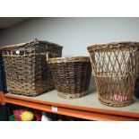 A WICKER LOG BASKET TOGETHER WITH TWO OTHERS