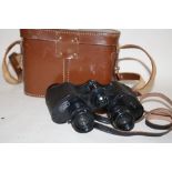 A PAIR OF LEATHER CASED HELLES OF PARIS 8X34 BINOCULARS