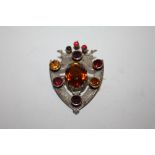 A SCOTTISH STYLE WHITE METAL MULTI GEM SHIELD SHAPED BROOCH