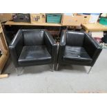 A PAIR OF MODERN BLACK SQUARE ARMCHAIRS