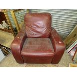 A LARGE MODERN LEATHER ARMCHAIR