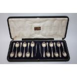 A CASED SET OF TWELVE HALLMARKED SILVER SPOONS AND SUGAR TONGS