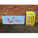 A LARGE ACRYLIC TUI ADVERTISING SHOP SIGN TOGETHER WITH A DIGITAL EXCHANGE RATE DISPLAY BOARD