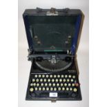 A VINTAGE REMINGTON POTABLE TYPEWRITER