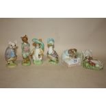 FOUR ROYAL ALBERT BEATRIX POTTER FIGURES TOGETHER WITH A GOLD STAMPED BESWICK BENJAMIN BUNNY