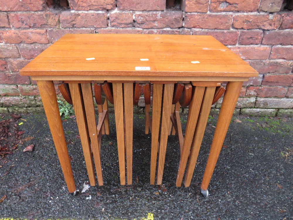 A RETRO TEAK NEST OF TABLES