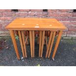 A RETRO TEAK NEST OF TABLES