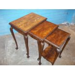 AN ANTIQUE INLAID NEST OF THREE TABLES WITH CABRIOLE CLAW AND BALL LEGS