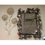 A MODERN MIRROR DECORATED WITH BUTTERFLIES TOGETHER WITH A WALL ART FLOWER