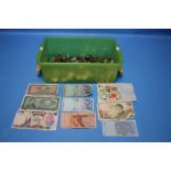 A BOX OF COINS AND BANKNOTES