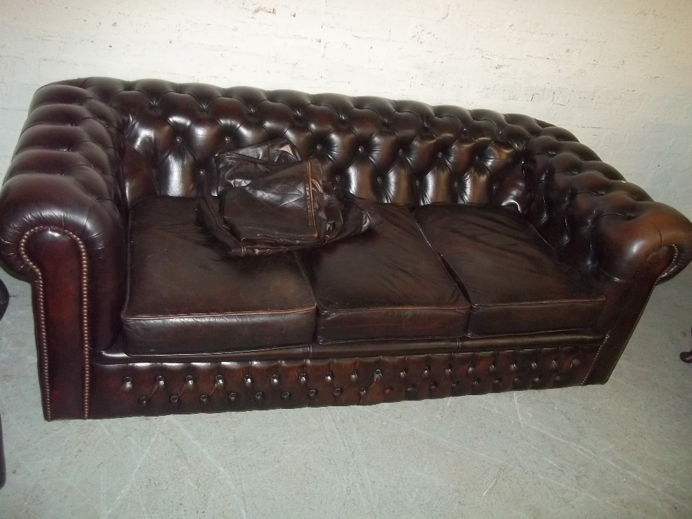 A BROWN LEATHER THREE SEATER CHESTERFIELD SOFA AND WING BACKED CHAIR (TWO PIECE SUITE) - Image 2 of 3