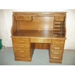 A MODERN OAK ROLL TOP TWIN PEDESTAL DESK