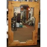 A PINE FRAMED MIRROR 133.5 X 89 CM