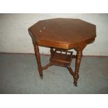 AN ANTIQUE OCTAGONAL EDWARDIAN STYLE TABLE WITH GALLERIED UNDERSHELF AND CASTORS