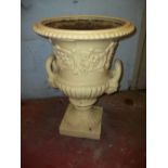 AN ANTIQUE CAST IRON GARDEN URN / PLANTER