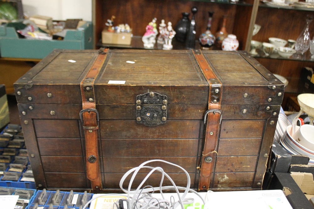 A REPRODUCTION WOODEN TRUNK