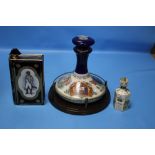 TWO NAVAL ITEMS TO INCLUDE PUSSERS RUM BOTTLE AND STOPPER COMMEMORATING HMS VICTORY TRAFALGAR 1805