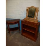 A SERPENTINE FRONTED HALL TABLE, A SMALL BOOKSHELF AND A PINE SWING MIRROR