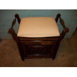 AN ANTIQUE PIANO MUSIC STORAGE STOOL