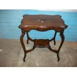 AN EDWARDIAN SIDE TABLE WITH SERPENTINE SHAPED TOP