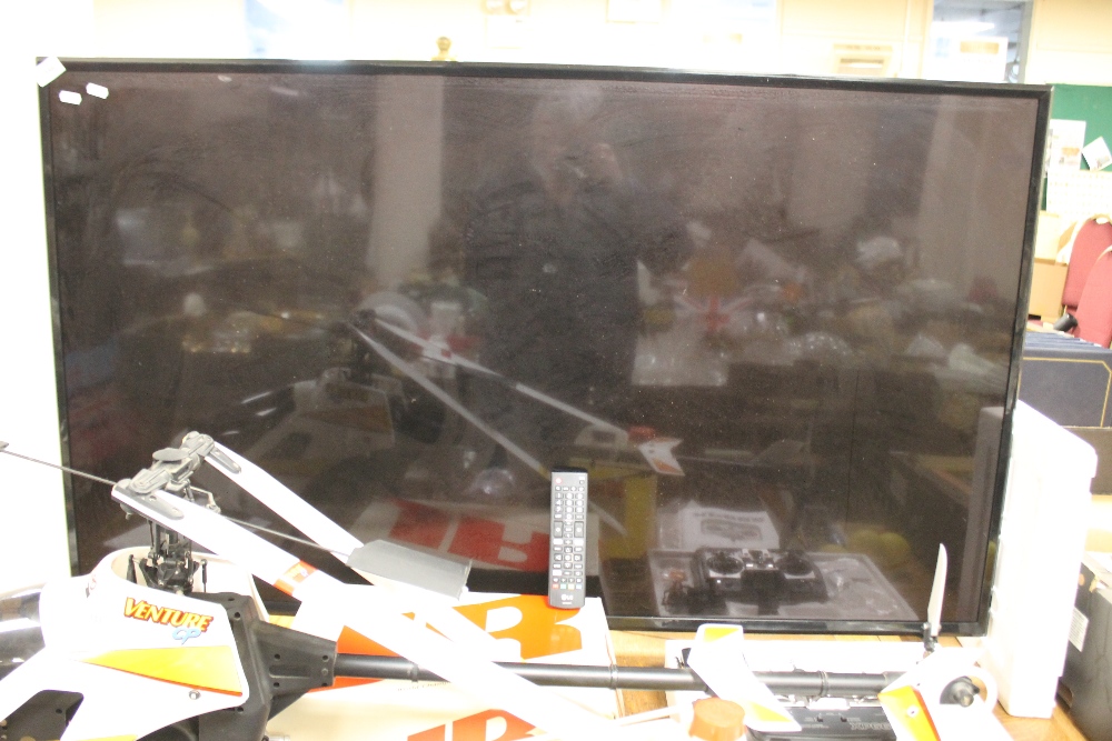 AN LG FLATSCREEN 56" TV WITH REMOTE CONTROL