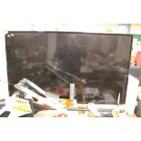 AN LG FLATSCREEN 56" TV WITH REMOTE CONTROL