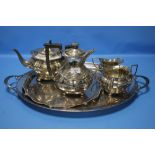 A FOUR PIECE SILVER PLATED TEASET WITH TWO TRAYS