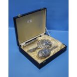 A CASED THREE PIECE HALLMARKED SILVER DRESSING TABLE SET