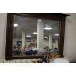 A SMALL MAHOGANY FRAMED OVERMANTEL STYLE MIRROR