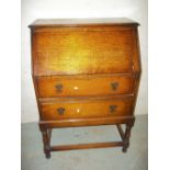 AN OAK BUREAU WRITING DESK